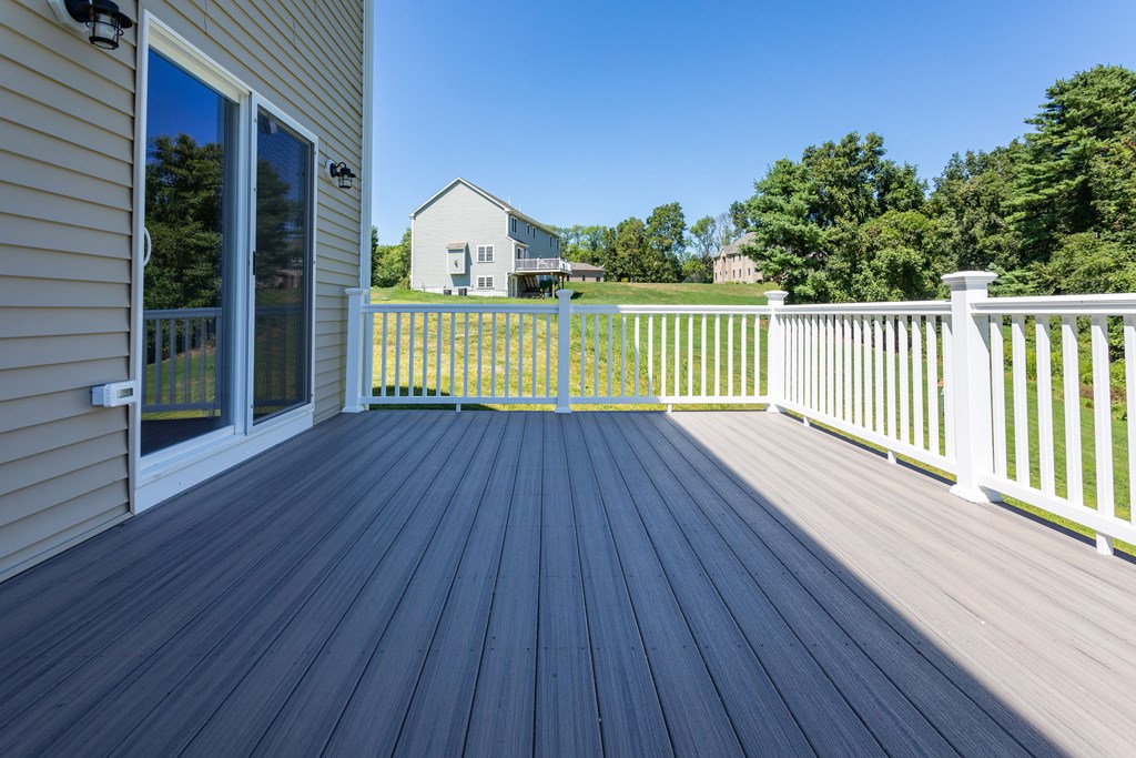 285 Putnam Hill Road Sutton, MA 01590 - Photo 6 of 6 a view of a house with a wooden deck