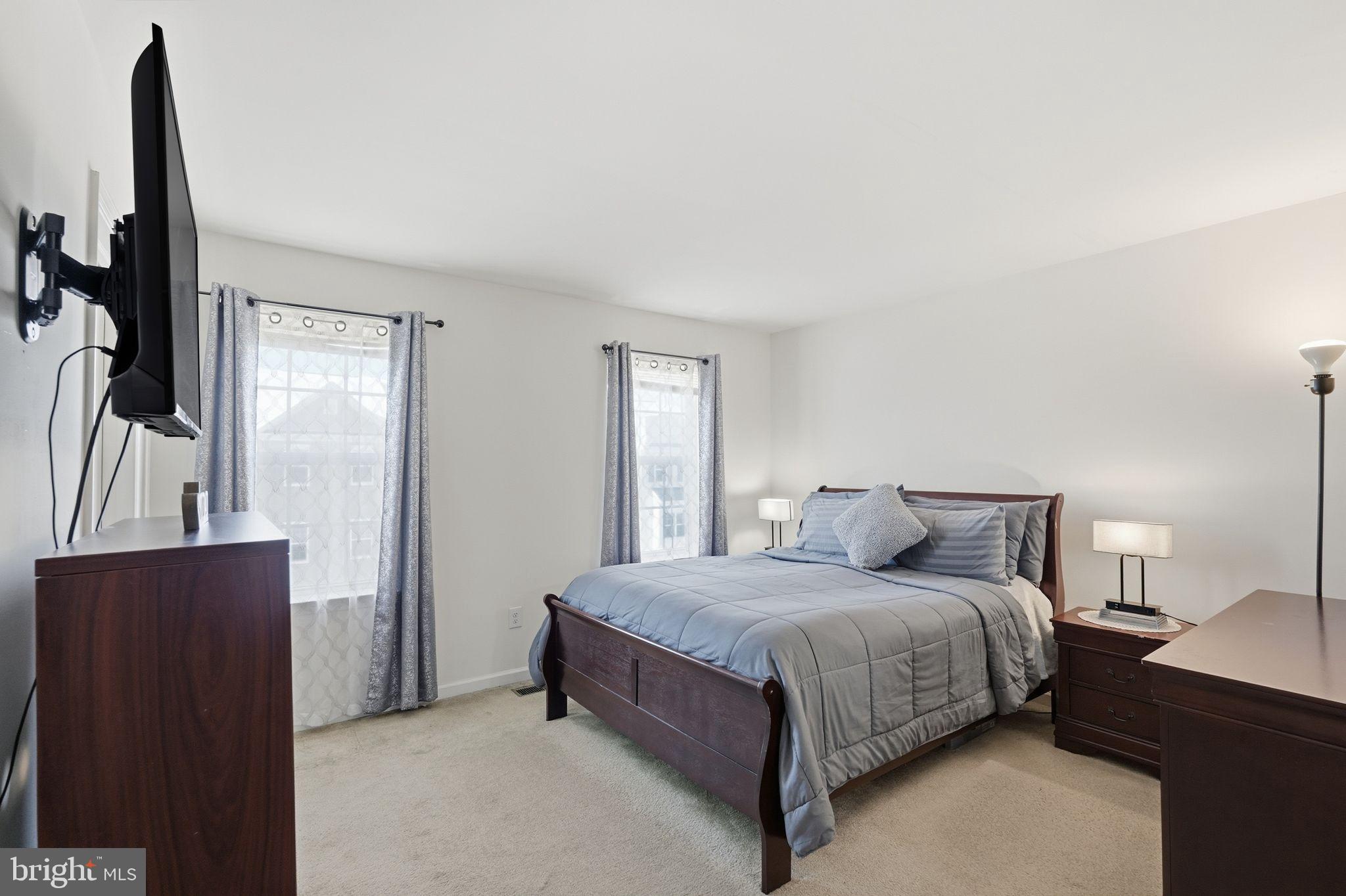 153 Mercer Court Fairless Hills, PA 19030 - Photo 15 of 29 a bedroom with a bed and wooden floor