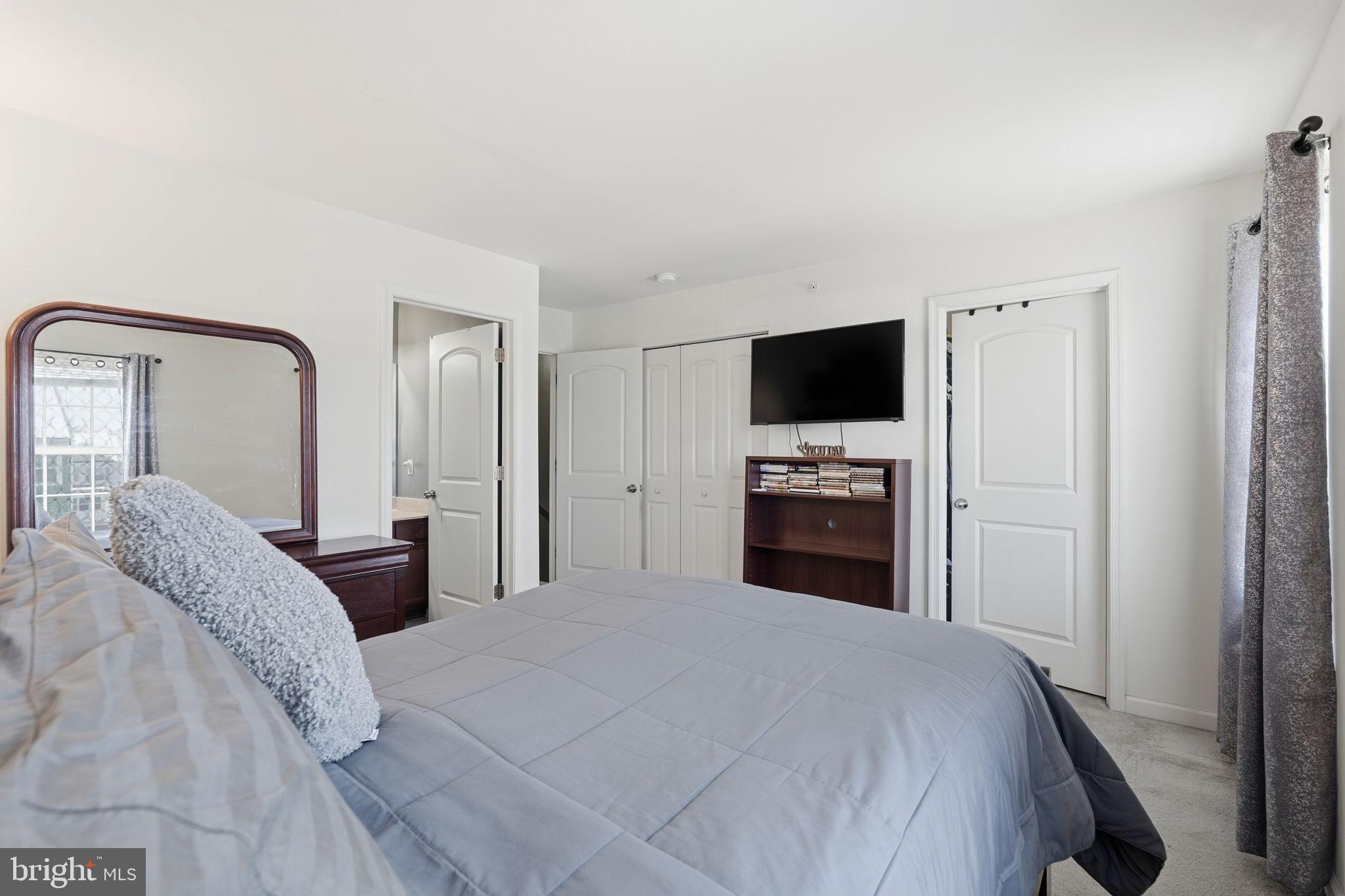 153 Mercer Court Fairless Hills, PA 19030 - Photo 16 of 29 a bedroom with a bed and a flat screen tv