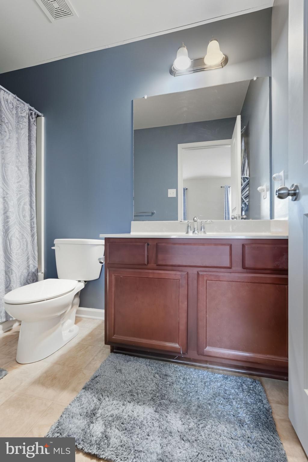 153 Mercer Court Fairless Hills, PA 19030 - Photo 17 of 29 a bathroom with a toilet a sink and mirror
