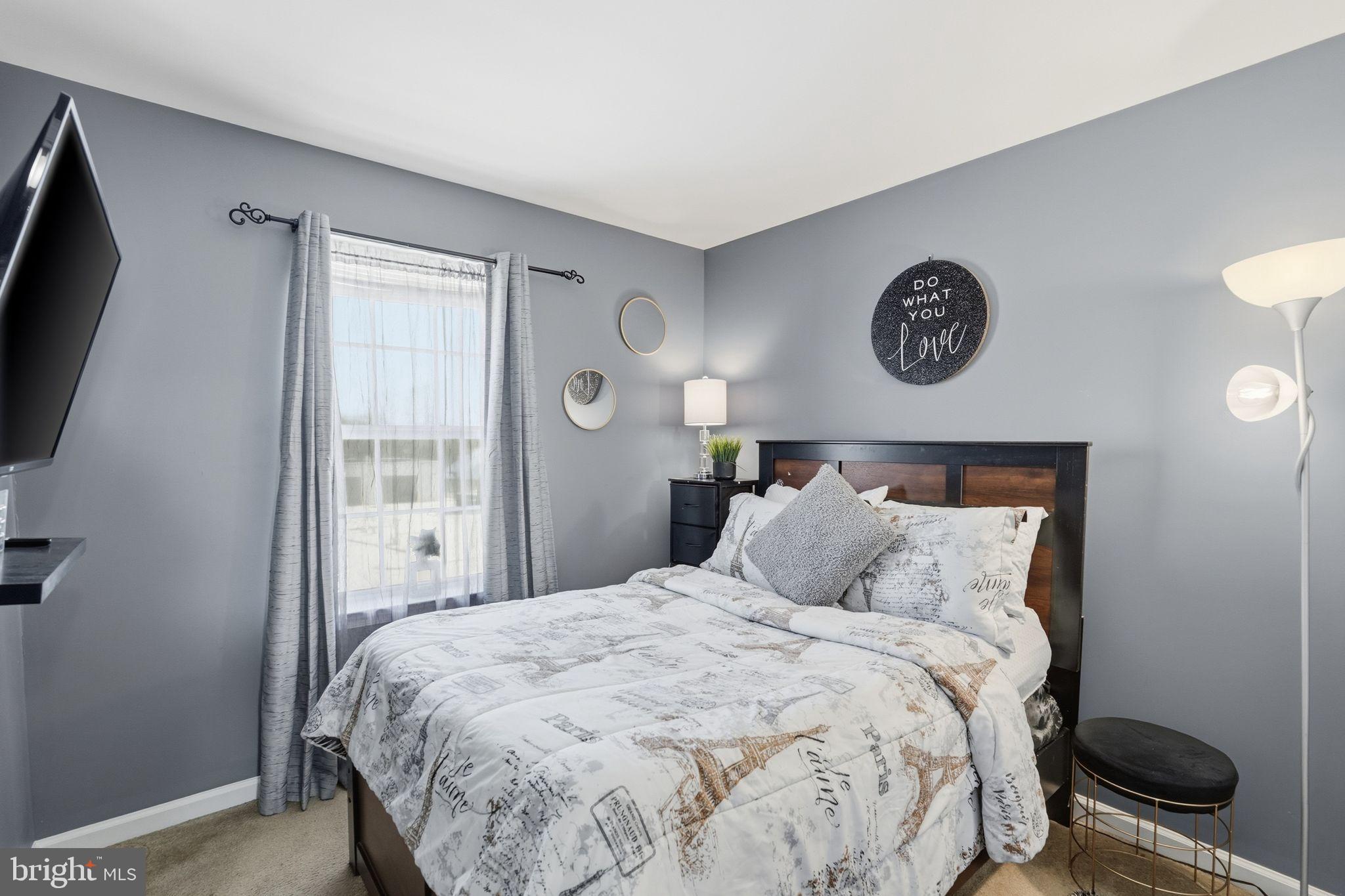 153 Mercer Court Fairless Hills, PA 19030 - Photo 21 of 29 a bedroom with a bed and a flat screen tv