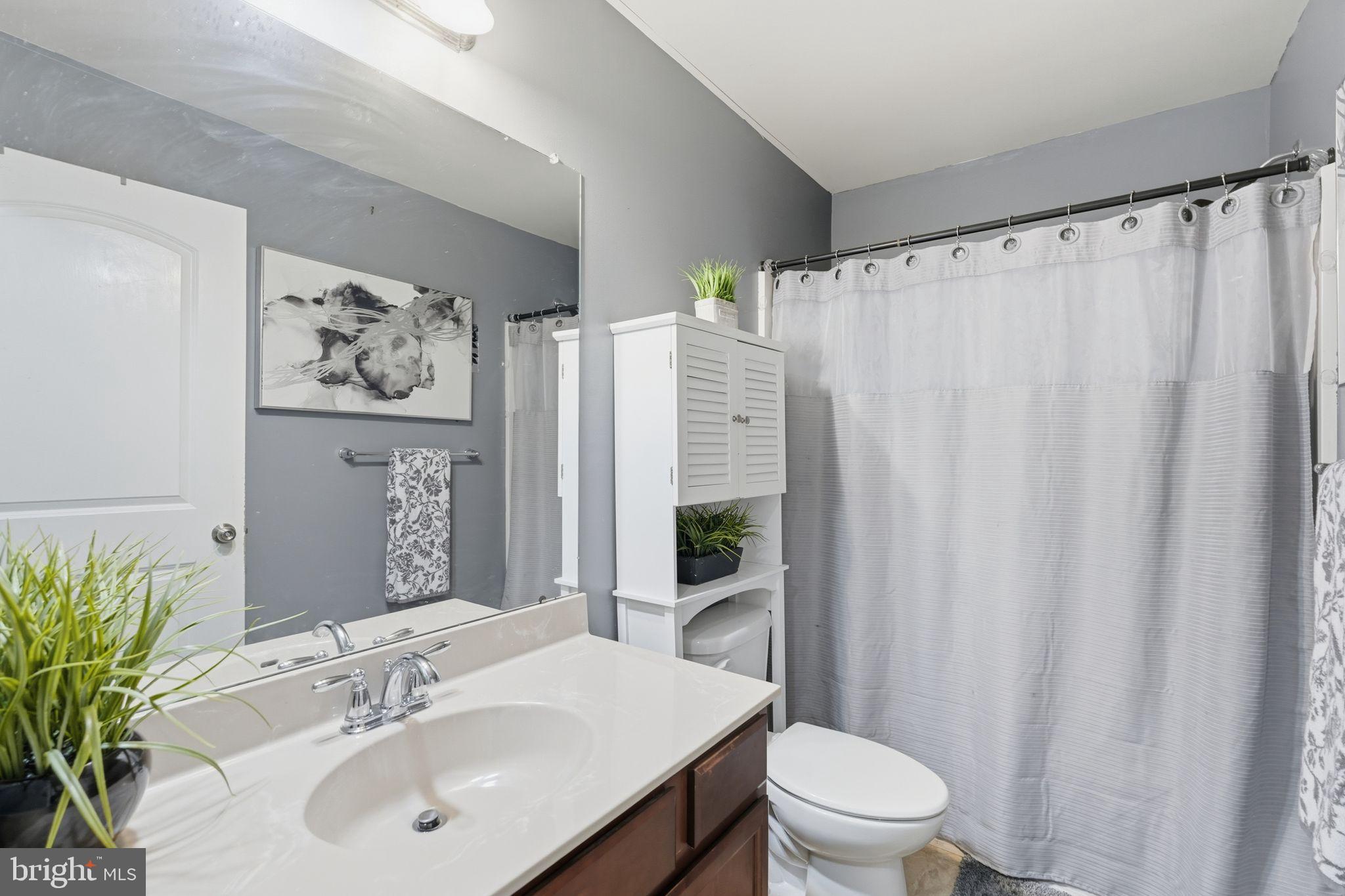 153 Mercer Court Fairless Hills, PA 19030 - Photo 23 of 29 a bathroom with a sink toilet and shower