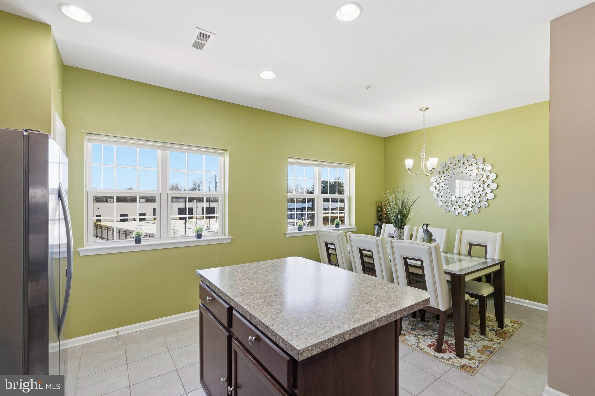 153 Mercer Court Fairless Hills, PA 19030 - Photo 7 of 29 a kitchen with a table and chairs in it