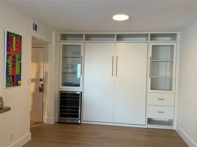 a view of walk in closet with empty racks