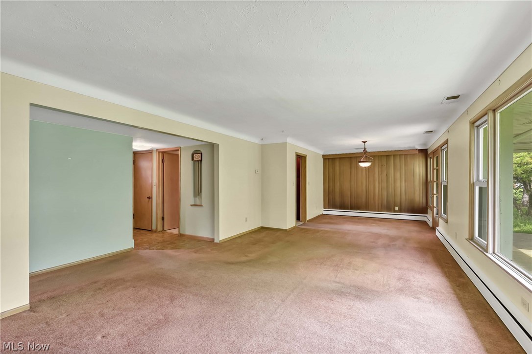 14593 Turney Road Maple Heights, OH 44137 - Photo 3 of 45 Empty room with carpet and a baseboard radiator