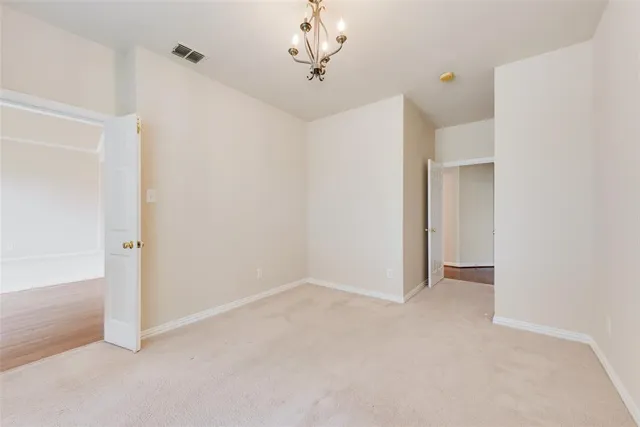 a view of an empty room with a fan