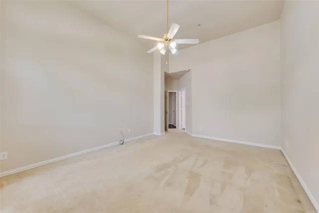 a bathroom with a tub sink shower and mirror