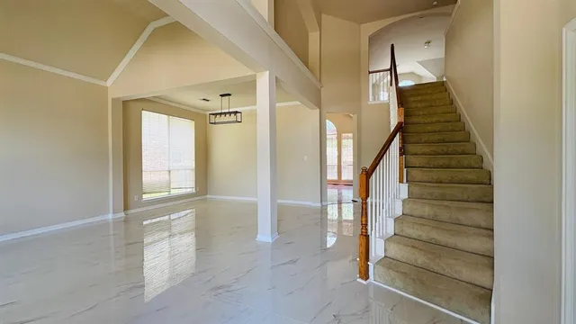 a view of an entryway with wooden floor