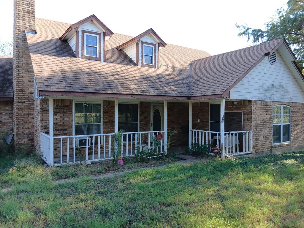 3010 Hcr 3363 Road Hubbard, TX 76648 - Photo 1 of 1 Cape cod-style house featuring a front lawn and covered porch