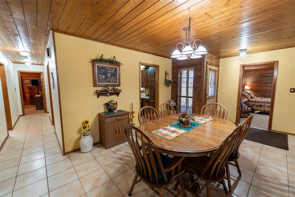 419 County Road Southeast Scroggins, TX 75480 - Photo 11 of 30 a view of a dining room with furniture window and wooden floor