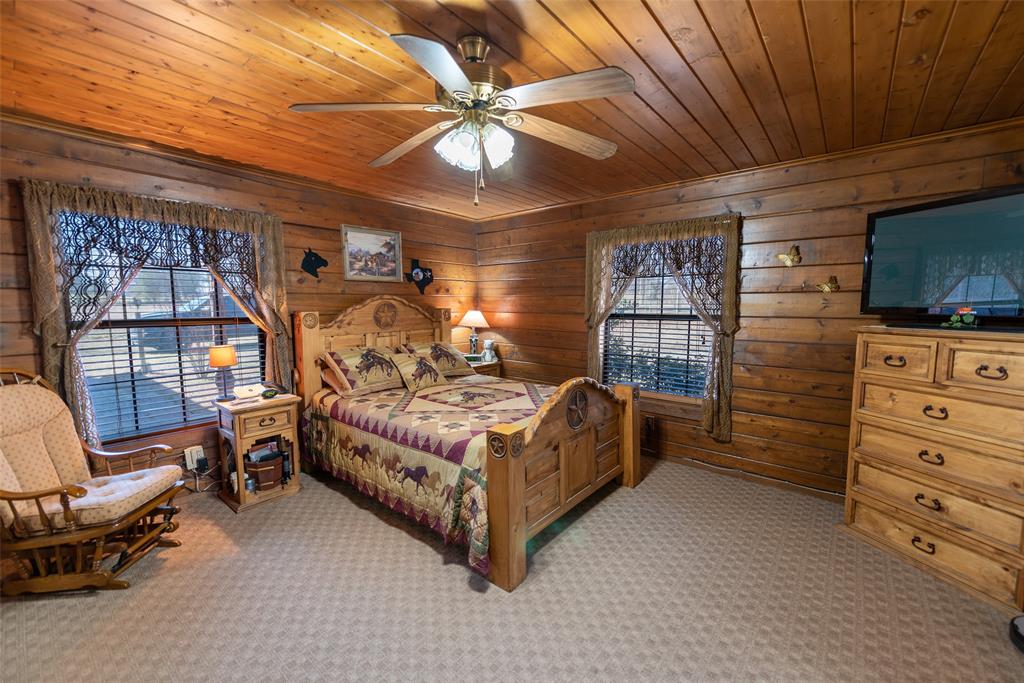 419 County Road Southeast Scroggins, TX 75480 - Photo 16 of 30 a bedroom with a bed and furniture