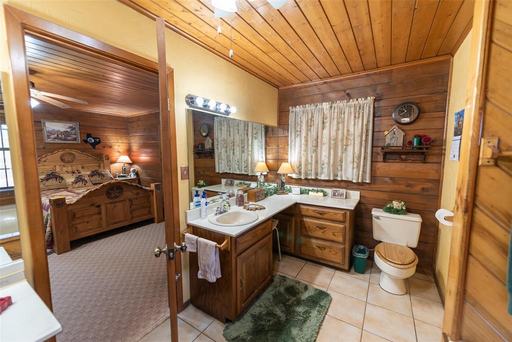 419 County Road Southeast Scroggins, TX 75480 - Photo 17 of 30 a kitchen with a sink appliances and cabinets