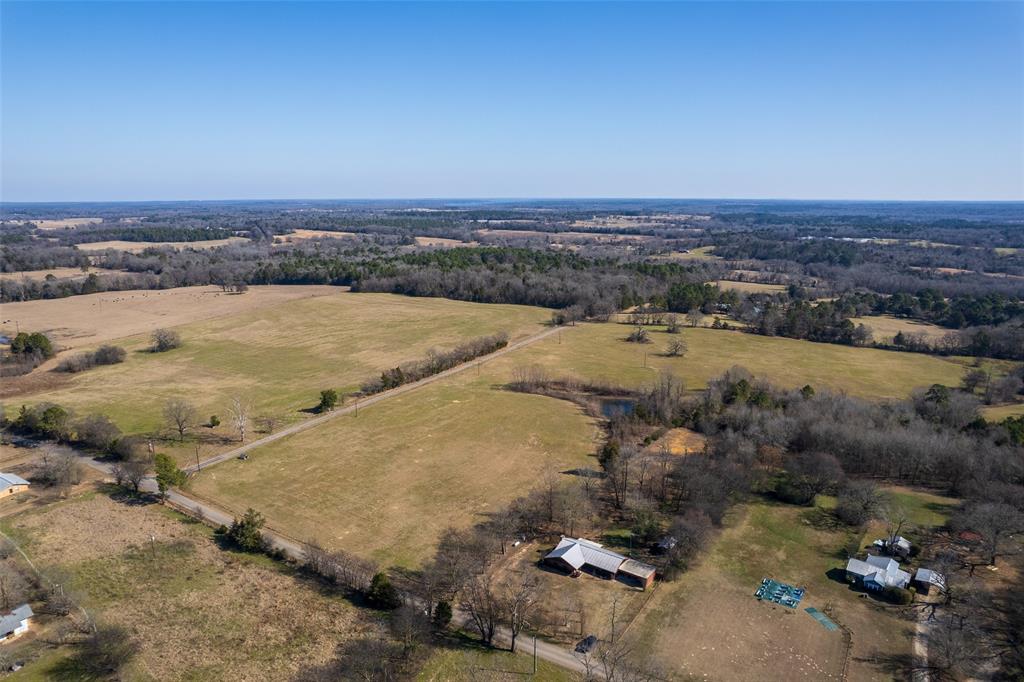 419 County Road Southeast Scroggins, TX 75480 - Photo 27 of 30 an aerial view of residential houses with outdoor space