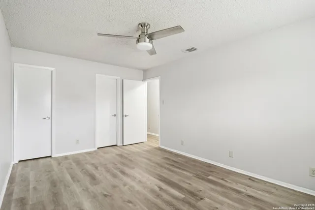 a bathroom with a granite countertop sink toilet and bathtub