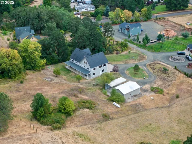 an aerial view of residential house with outdoor space