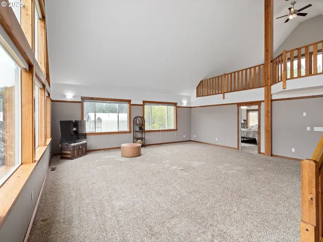 an empty room with furniture and a window