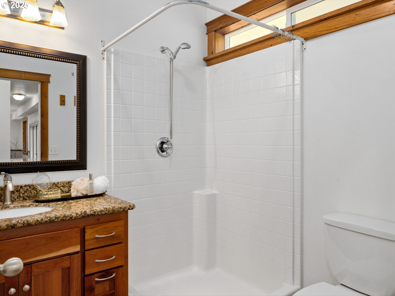 33678 Marys River Estates Road Philomath, OR 97370 - Photo 32 of 48 a bathroom with a granite countertop sink a mirror and shower