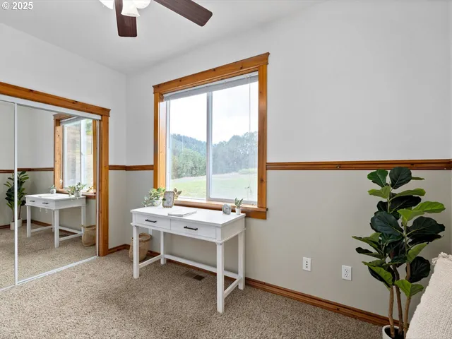a spacious bedroom with a bed and a window