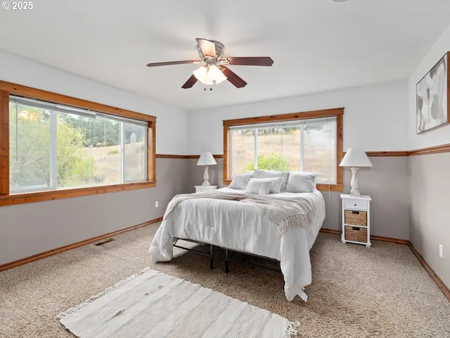 a bed room with a bed and a chandelier