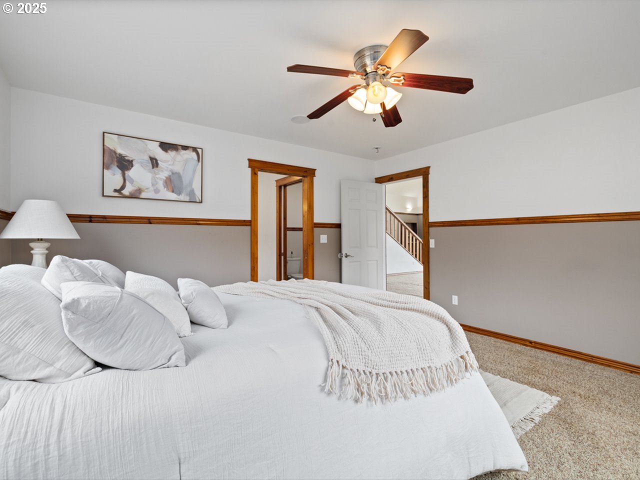 33678 Marys River Estates Road Philomath, OR 97370 - Photo 37 of 48 a bedroom with a large bed and a chandelier