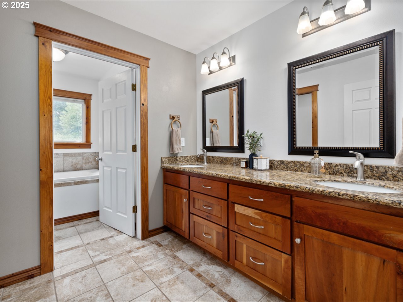 33678 Marys River Estates Road Philomath, OR 97370 - Photo 48 of 48 a bathroom with a granite countertop sink and a mirror