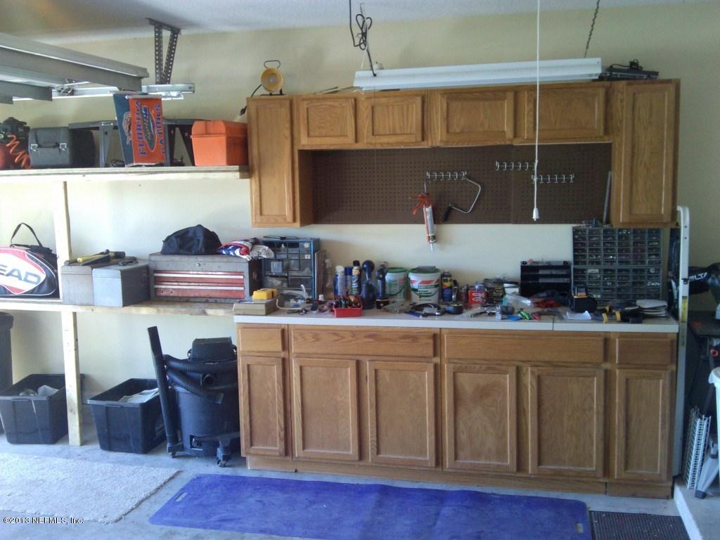 716 South Lilac Loop St. Johns, FL 32259 - Photo 11 of 22 a kitchen with a refrigerator and a stove