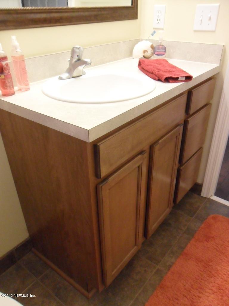 716 South Lilac Loop St. Johns, FL 32259 - Photo 15 of 22 a bathroom with a sink and a mirror