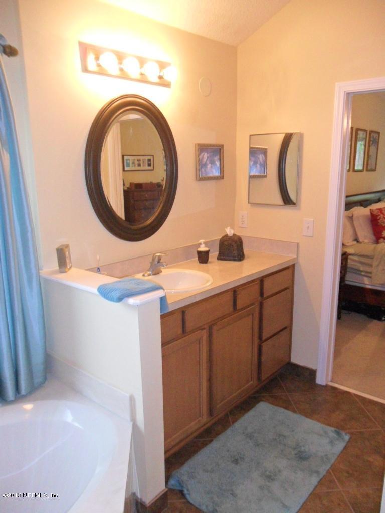 716 South Lilac Loop St. Johns, FL 32259 - Photo 20 of 22 a bathroom with a sink and a mirror