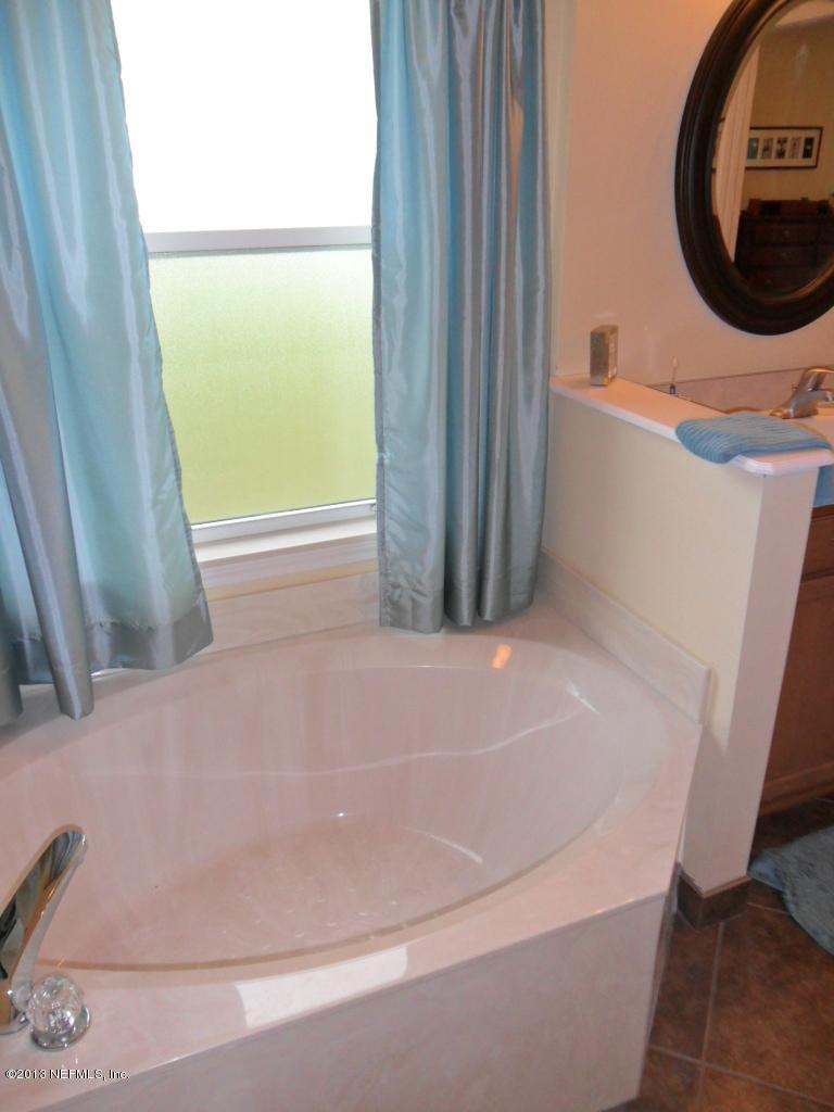 716 South Lilac Loop St. Johns, FL 32259 - Photo 21 of 22 a bathroom with a bathtub