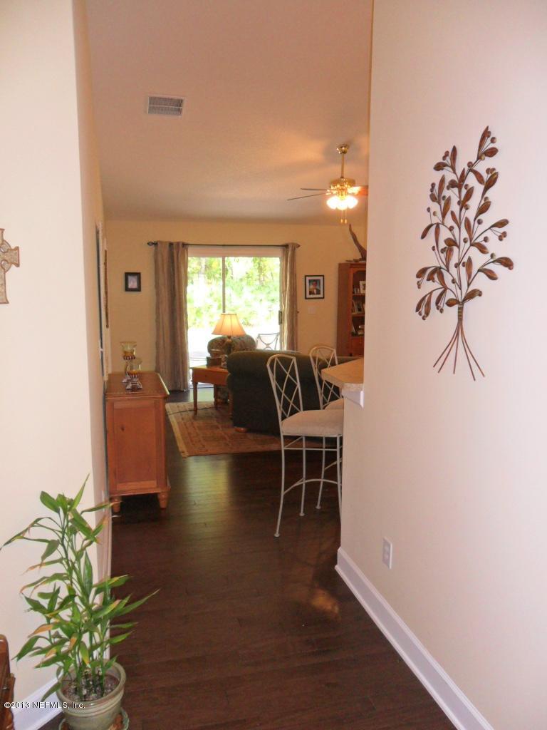 716 South Lilac Loop St. Johns, FL 32259 - Photo 3 of 22 a living room with furniture and a large window