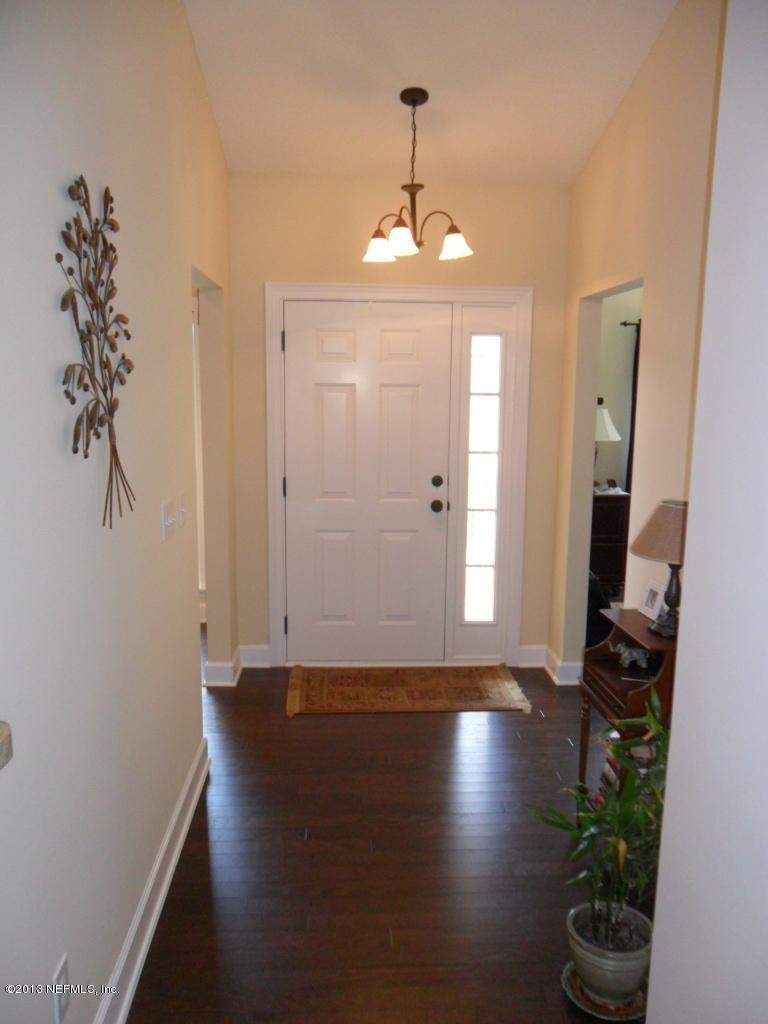 716 South Lilac Loop St. Johns, FL 32259 - Photo 4 of 22 a view of livingroom with hardwood floor and hallway
