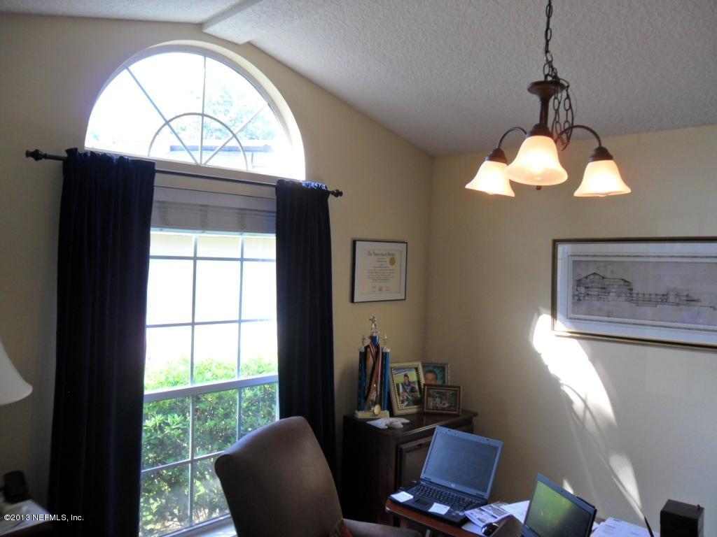 716 South Lilac Loop St. Johns, FL 32259 - Photo 6 of 22 a room with furniture and a large window