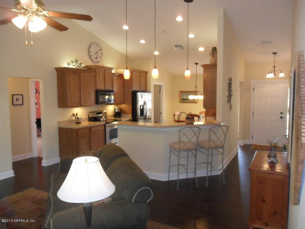 716 South Lilac Loop St. Johns, FL 32259 - Photo 9 of 22 a living room with furniture and a chandelier