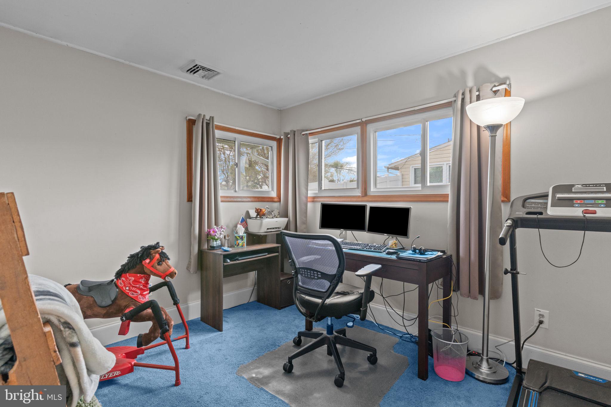 58 Tinder Road Levittown, PA 19056 - Photo 11 of 20 a view of a workspace with furniture and a window