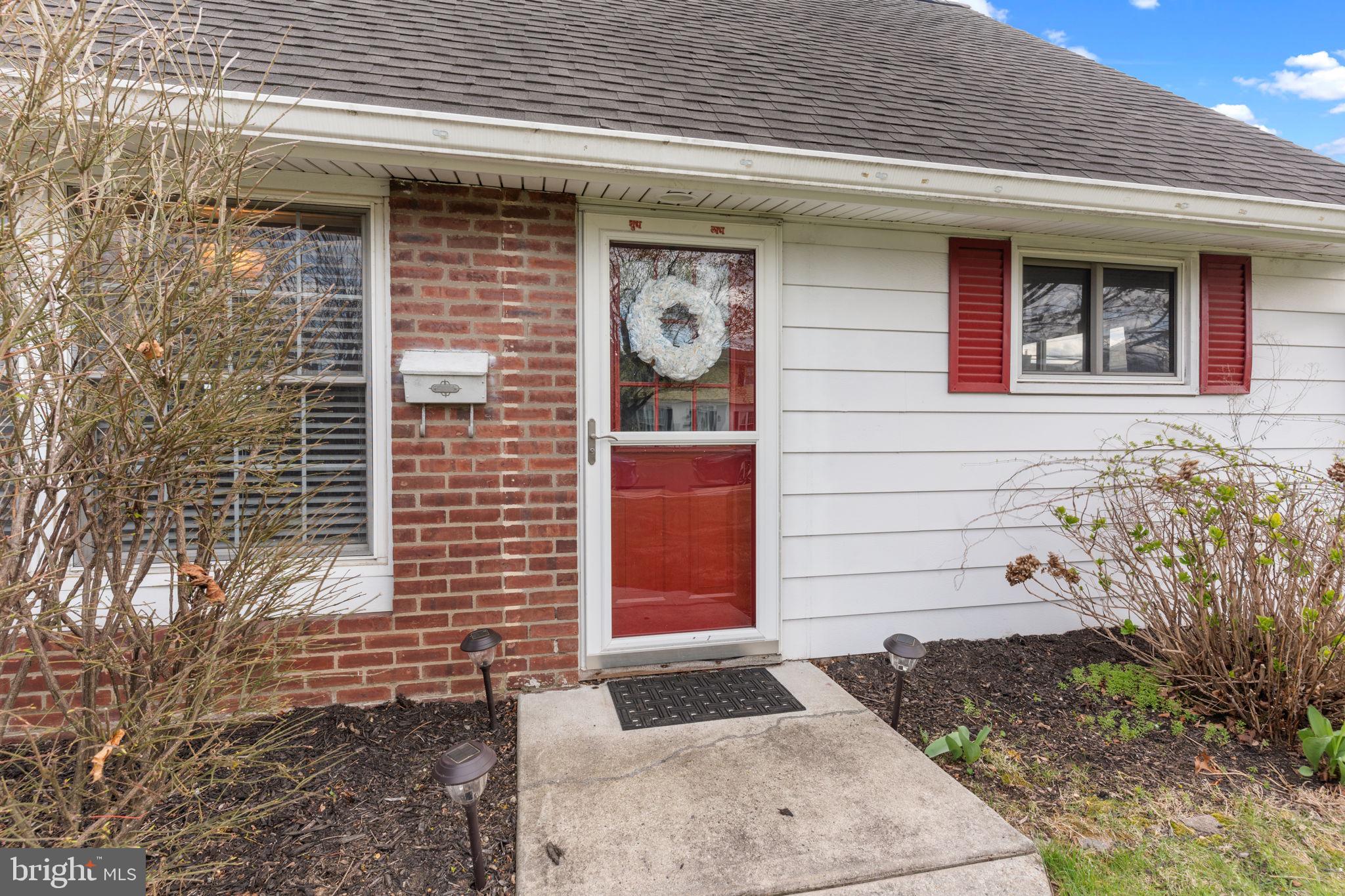 58 Tinder Road Levittown, PA 19056 - Photo 3 of 20 a front view of a house with a garage
