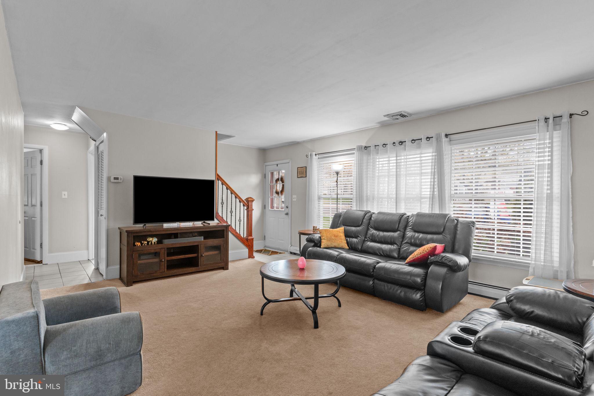 58 Tinder Road Levittown, PA 19056 - Photo 5 of 20 a living room with furniture and a flat screen tv