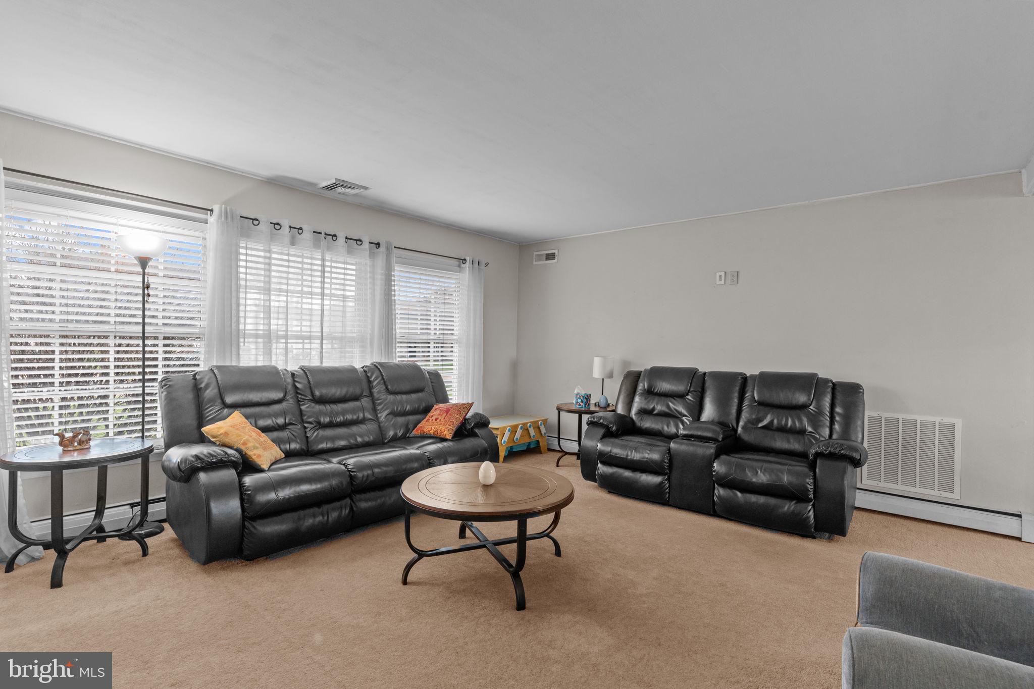 58 Tinder Road Levittown, PA 19056 - Photo 6 of 20 a living room with furniture and a large window
