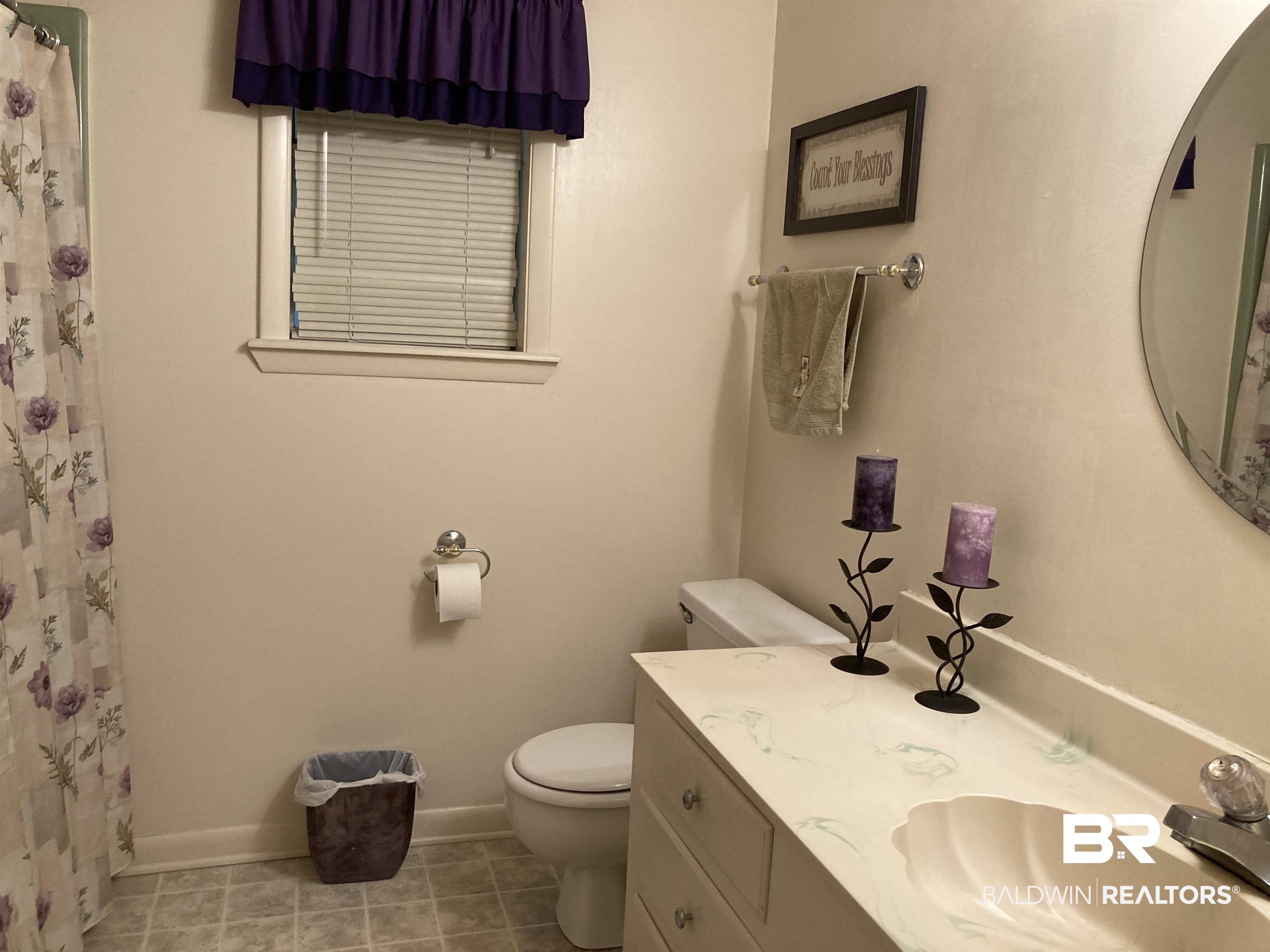 6151 Meadows Road Walnut Hill, FL 32568 - Photo 19 of 29 Bathroom with tile patterned floors, vanity, toilet, and walk in shower