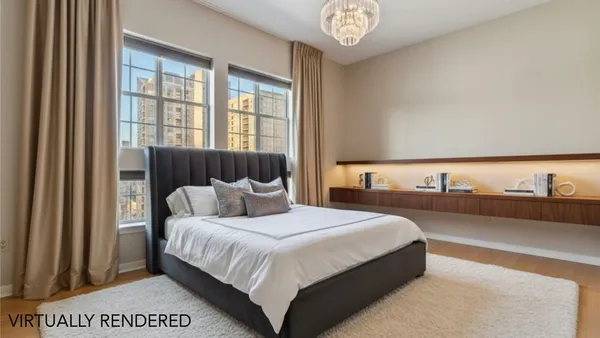 a bedroom with a bed and a night stand