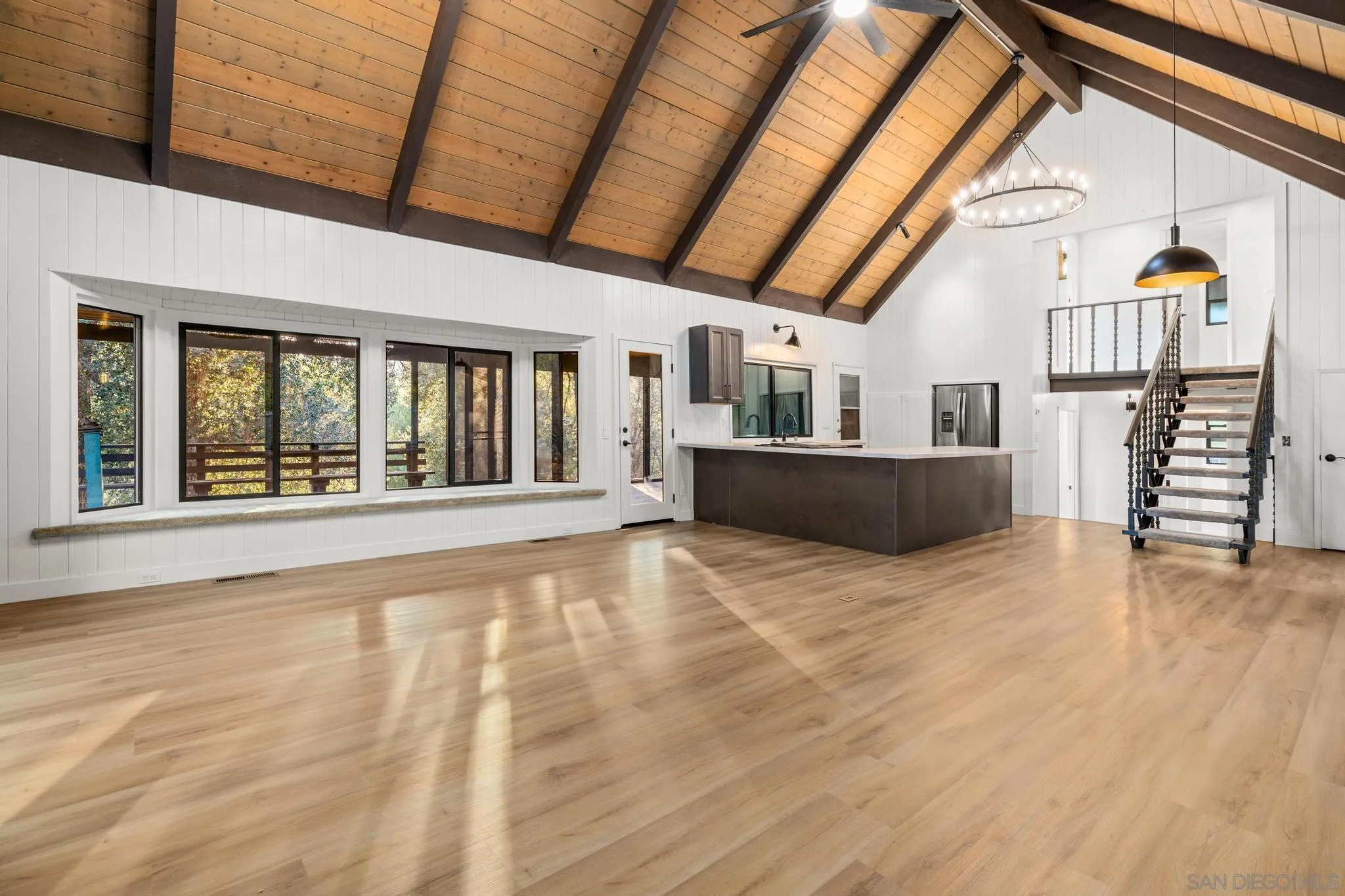 8648 Valley View Trail Pine Valley, CA 91962 - Photo 13 of 50 a view of an empty room with wooden floor and furniture