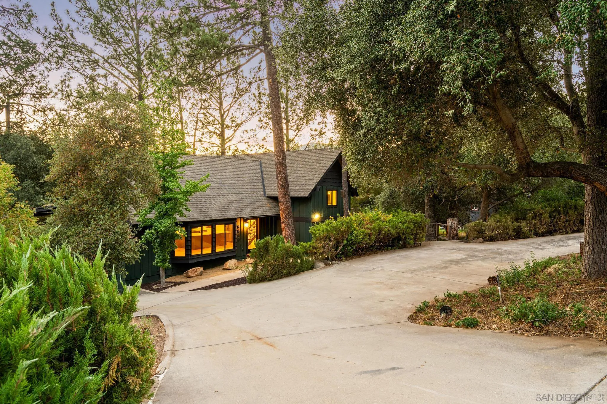 8648 Valley View Trail Pine Valley, CA 91962 - Photo 47 of 50 a front view of a house with a yard and a large tree