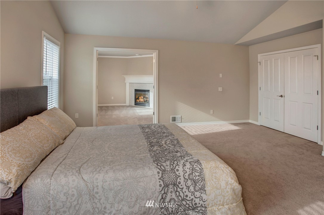 4014 215th Street Southeast Bothell, WA 98021 - Photo 13 of 25 a bedroom with a bed and a potted plant