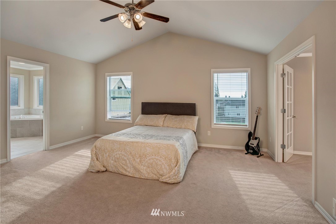 4014 215th Street Southeast Bothell, WA 98021 - Photo 14 of 25 a bedroom with a bed and a window