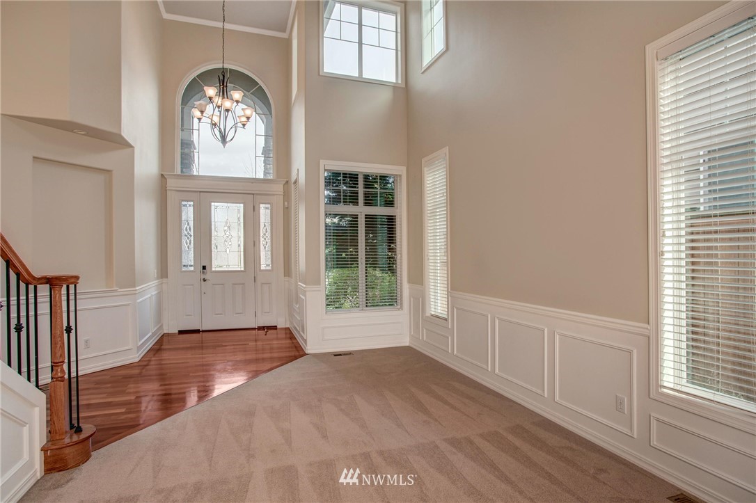 4014 215th Street Southeast Bothell, WA 98021 - Photo 3 of 25 an empty room with wooden floor and windows