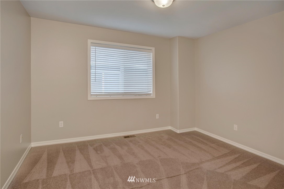 4014 215th Street Southeast Bothell, WA 98021 - Photo 22 of 25 an empty room with a window