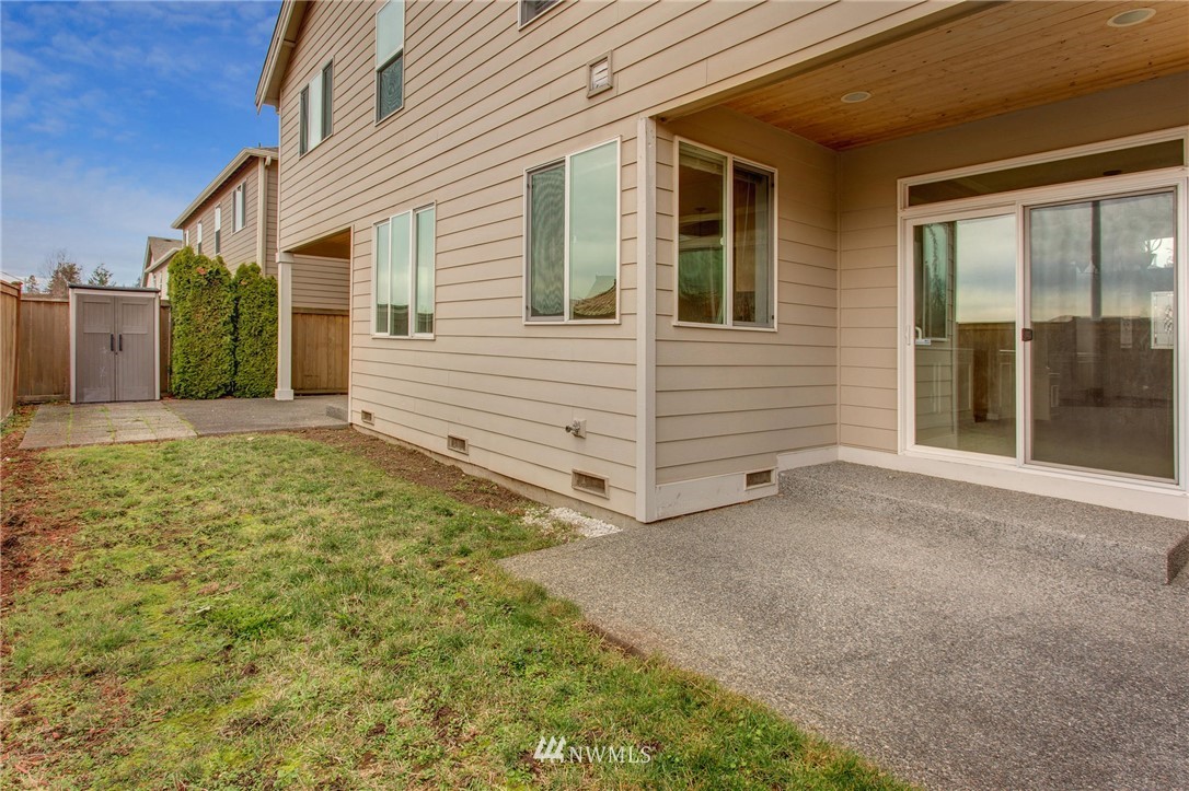 4014 215th Street Southeast Bothell, WA 98021 - Photo 25 of 25 a view of house with backyard and glass windows