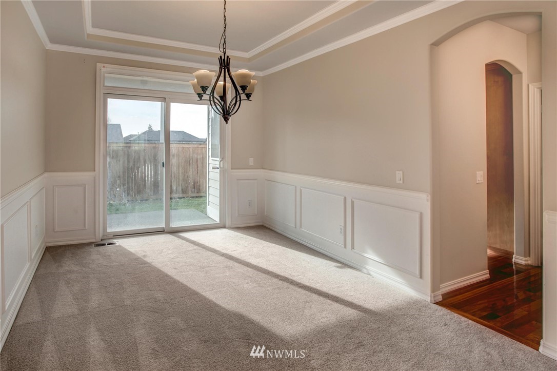 4014 215th Street Southeast Bothell, WA 98021 - Photo 5 of 25 a view of empty room with window and chandelier