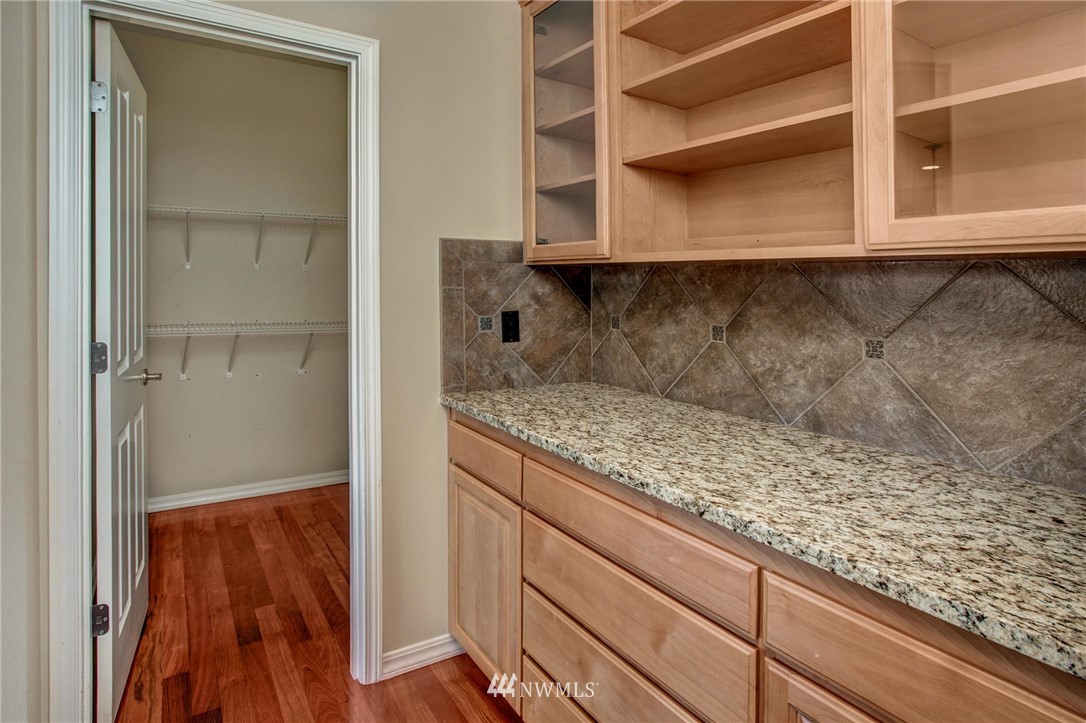 4014 215th Street Southeast Bothell, WA 98021 - Photo 6 of 25 a kitchen with a cabinets and a stove