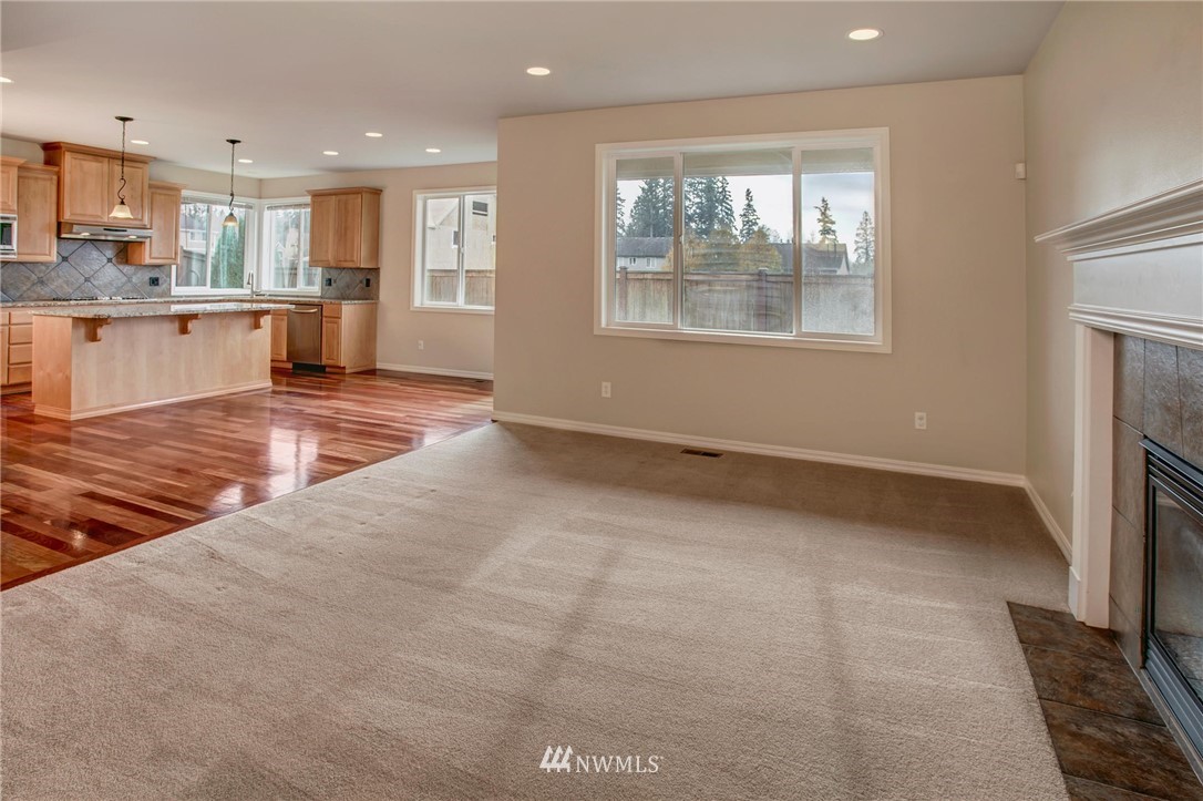 4014 215th Street Southeast Bothell, WA 98021 - Photo 9 of 25 a view of a kitchen with furniture and windows