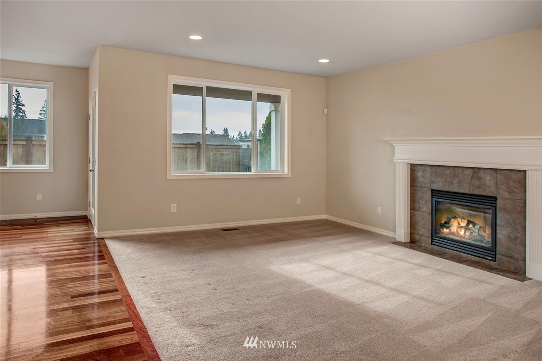 4014 215th Street Southeast Bothell, WA 98021 - Photo 10 of 25 a view of an empty room with window and fire place